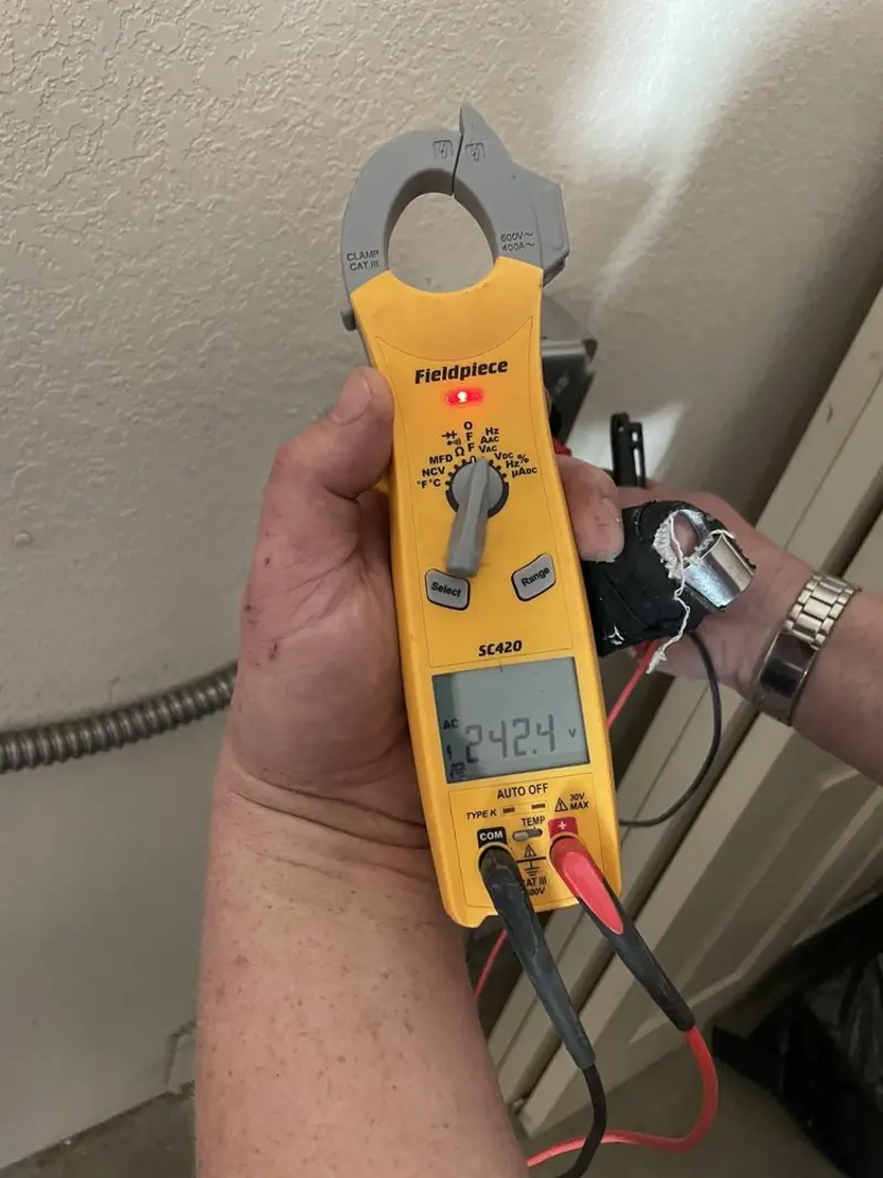 Voltage testing with clamp meter during Ceiling Fan Installation in Willow Park
